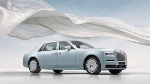 A high-resolution, close-up shot of a luxurious Rolls-Royce Phantom sedan showcasing... wallpaper