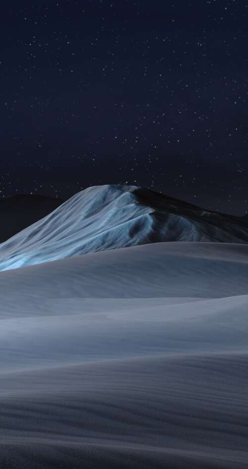 A dramatic night landscape showing snow mountains under a starry sky with red glowing... free wallpaper