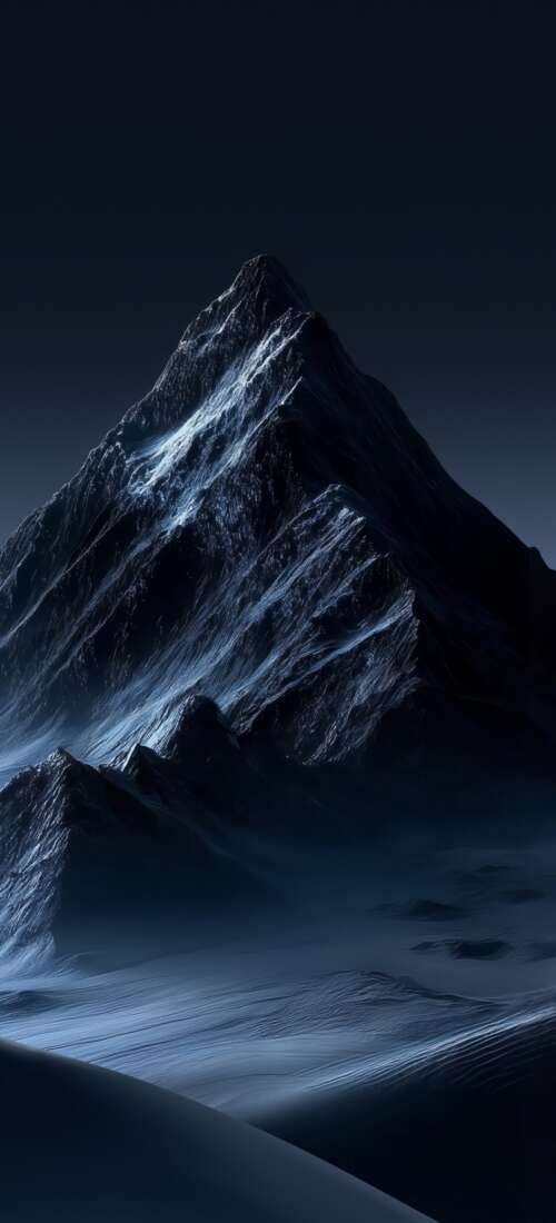 Snowy mountain peaks under a dark blue night sky in an ethereal landscape wallpaper