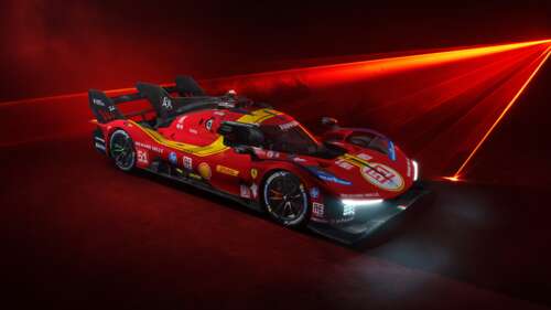 Close-up view of the Ferrari 499P Le Mans Hypercar on a professional racing circuit. wallpaper