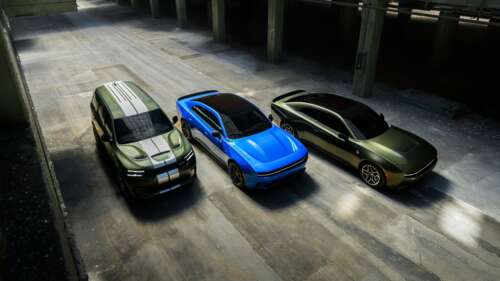 A high-resolution shot of a modern 2026 Dodge Charger Daytona Scat Pack and Dodge... wallpaper