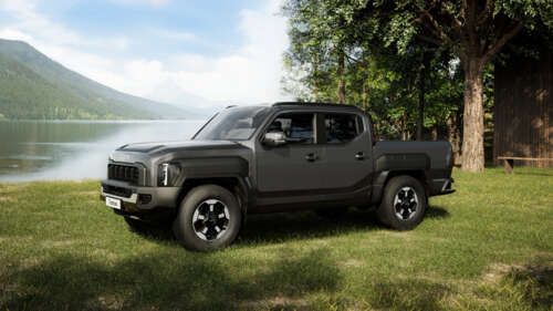 A sleek, futuristic 2025 concept pickup truck with aerodynamic lines and advanced... wallpaper