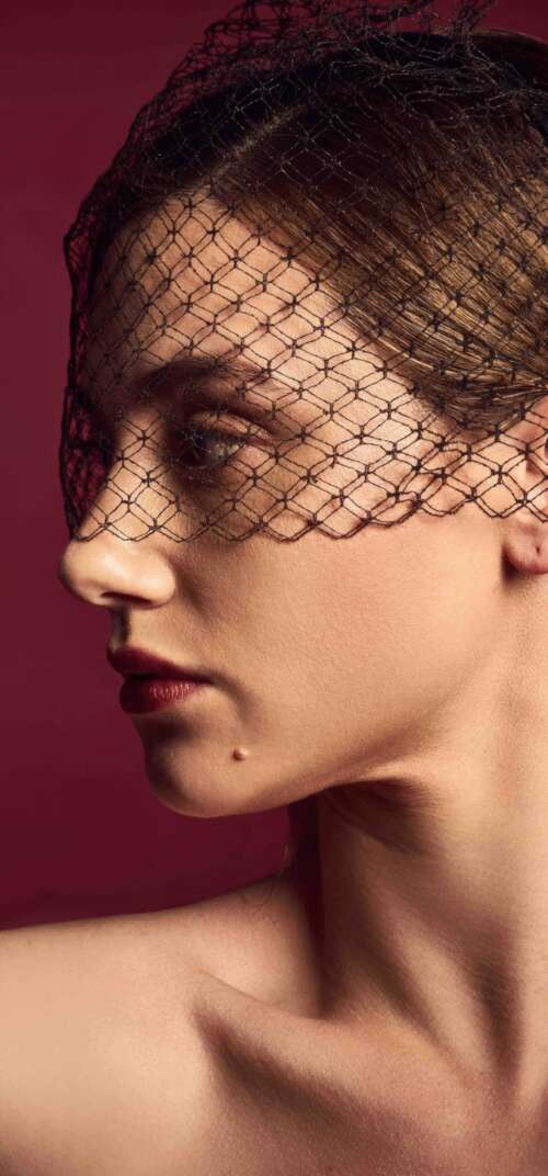 A professional portrait of Lili Reinhart against a deep red background, Hunger Magazine... background images hd