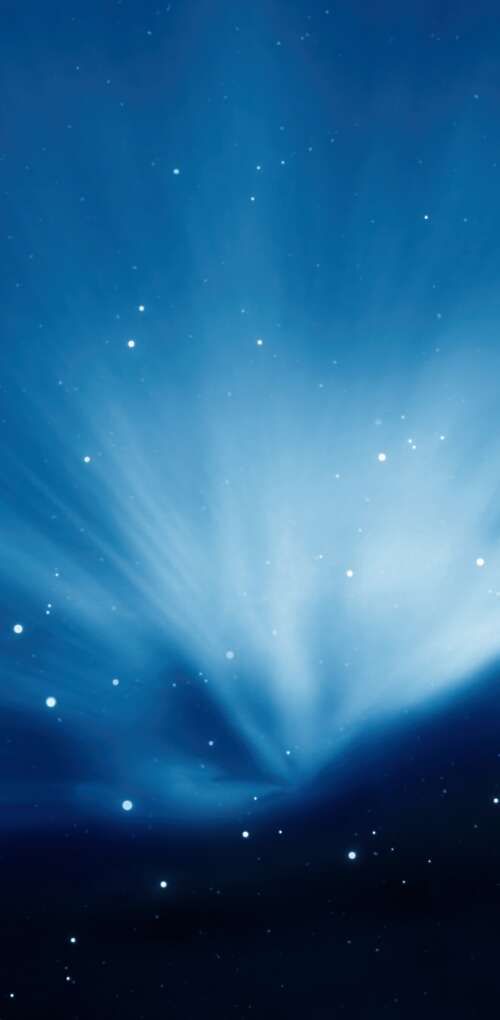 Vibrant Aurora Borealis waves over a dark blue night sky with a Mac OS X Leopard... wallpaper