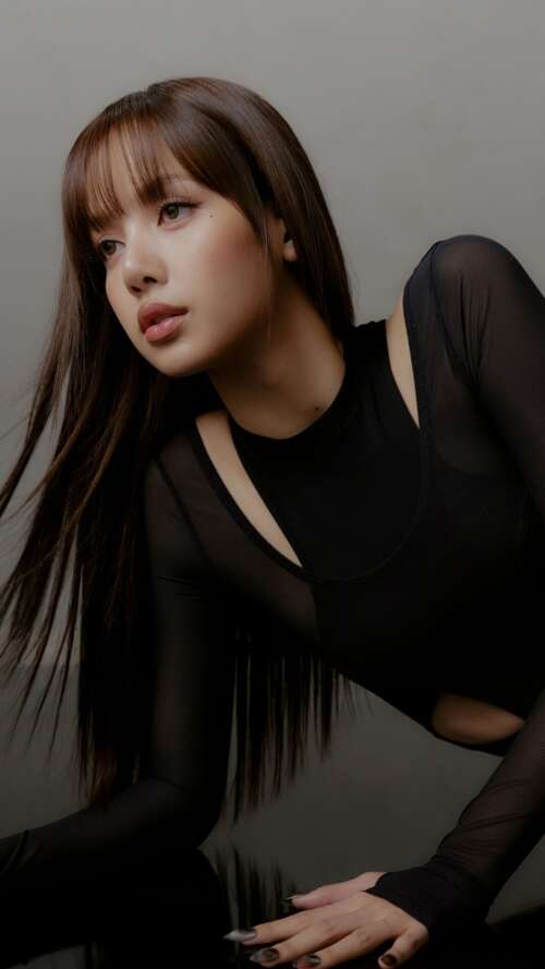 A high-resolution, dark-themed portrait of Lisa wearing an elegant black dress in... download free phone wallpaper