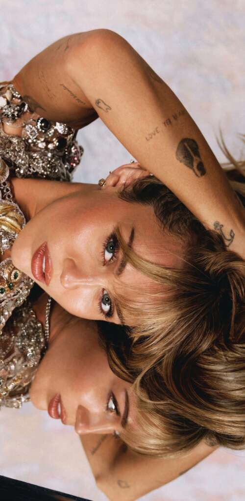 A high-resolution, professional 5K photoshoot portrait of Miley Cyrus featuring modern... free background