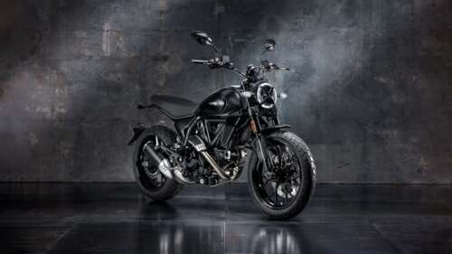 A sleek and polished 2025 cafe racer motorcycle featuring a neo-retro design with... wallpaper