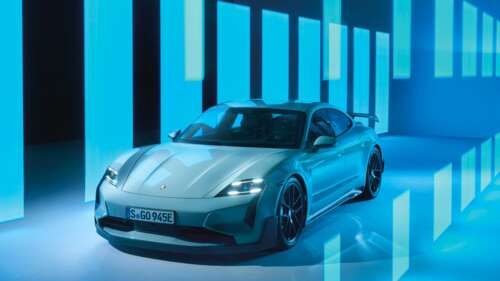 Porsche Taycan Turbo GT with Weissach package displayed against a solid cyan background. wallpaper