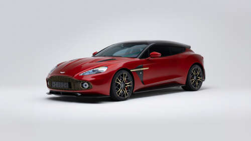 A vibrant red Aston Martin Vanquish luxury sports car isolated on a solid white background. free wallpaper