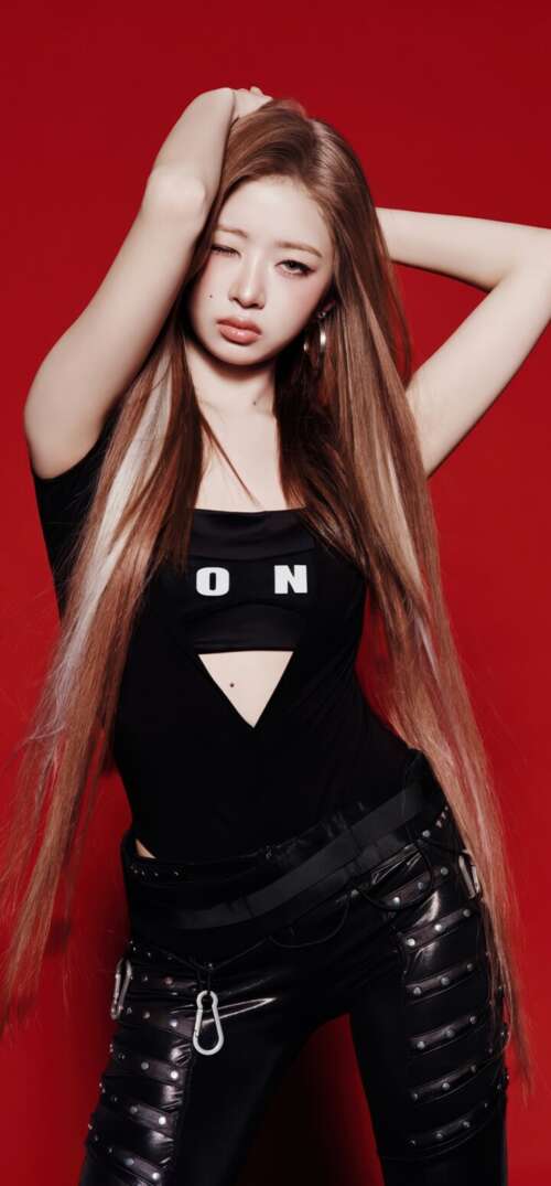 Rei from the K-pop group IVE wearing a black dress against a solid red background free background