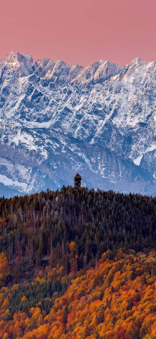 A majestic landscape of the Tatra Mountains featuring colorful autumn forests, snow-covered... wallpaper