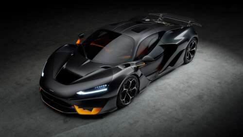 A cinematic, high-resolution close-up of a McLaren W1 supercar in a dark, moody setting,... wallpaper