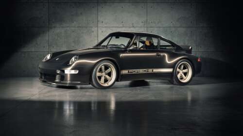 A high-resolution, detailed view of a classic Porsche 911 sports car featuring its... free wallpaper