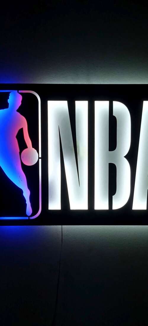 Glowing neon basketball sign with NBA-inspired elements on a dark background. wallpaper