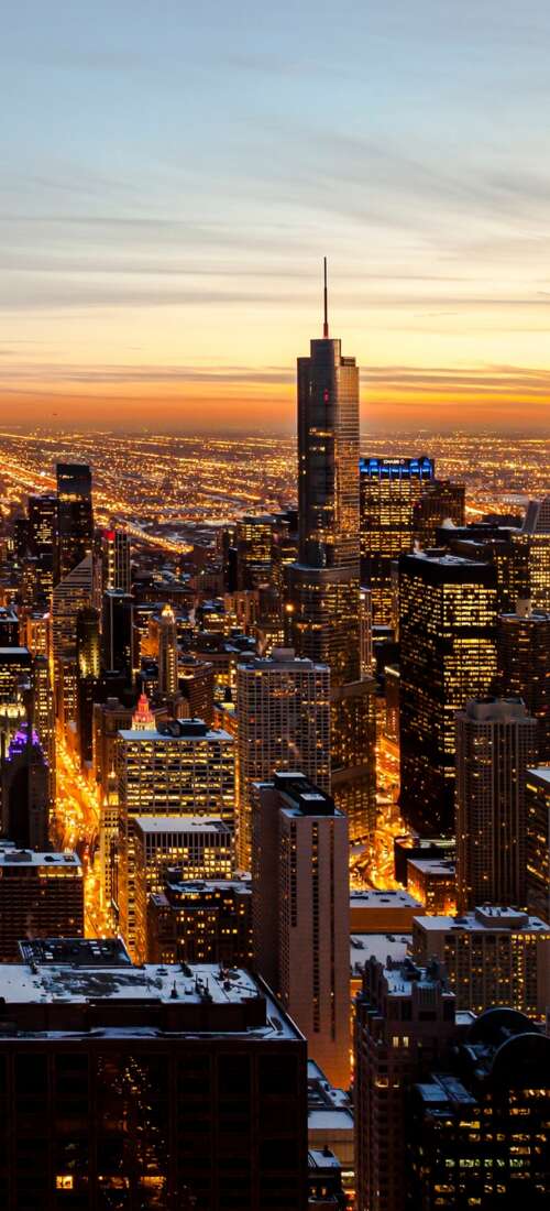 Aerial photography of the Chicago downtown skyline featuring skyscrapers under a... wallpaper images