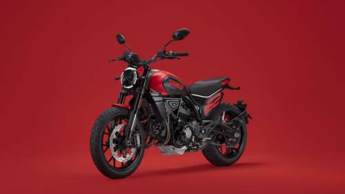 A 2023 Ducati Scrambler Full Throttle motorcycle positioned against a bright red... wallpaper download