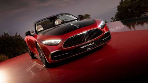 A luxurious red 2024 Mercedes-Maybach SL 680 showcasing its sleek design and premium... wallpaper