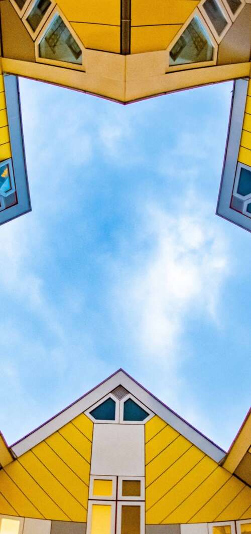 An aerial drone view of the modern, tilted Cube Houses in Rotterdam, Netherlands,... wallpaper