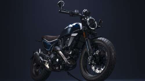 A sleek 2023 Ducati Scrambler Nightshift motorcycle positioned against a dark, minimalist... wallpaper