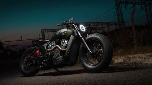 A detailed view of a custom cruiser motorcycle with polished chrome accents and a... wallpaper