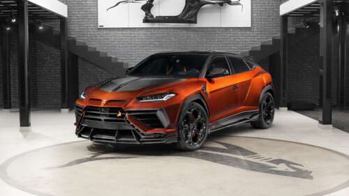 A matte black Lamborghini Urus R'Evo Stealth Edition featuring a custom widebody... wallpaper
