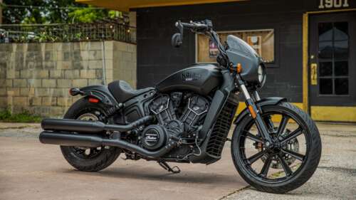 A close-up, high-resolution shot of a black 2022 Indian Scout Rogue cruiser motorcycle. wallpaper