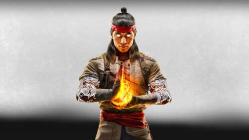 Liu Kang from Mortal Kombat 1 in a martial arts pose with fire effects. wallpaper