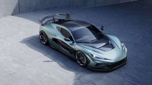 A high-resolution close-up of the Rimac Nevera R electric hypercar with its distinctive... wallpaper