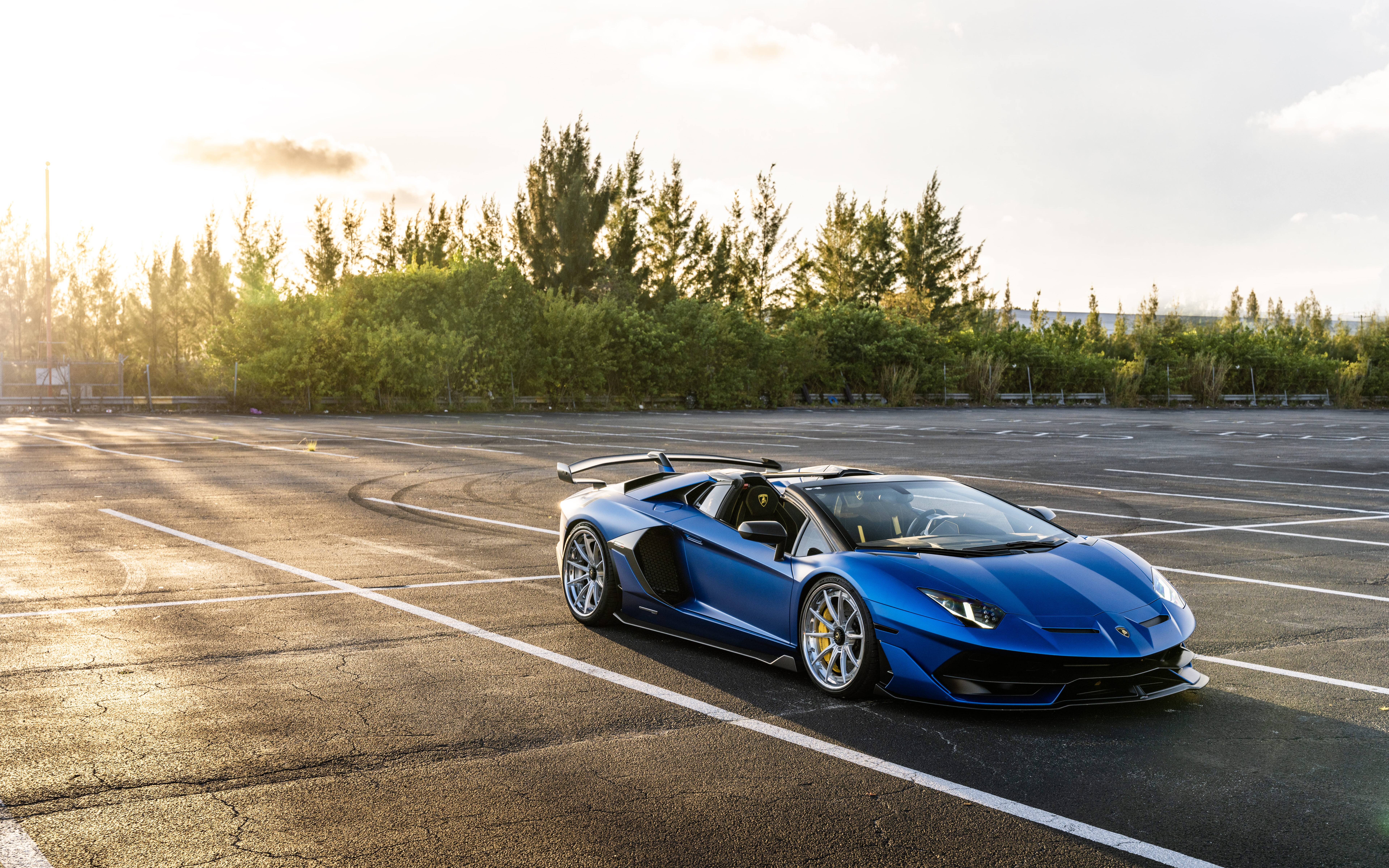 A close-up shot of a luxury Lamborghini sports car showcasing its aerodynamic silhouette.
