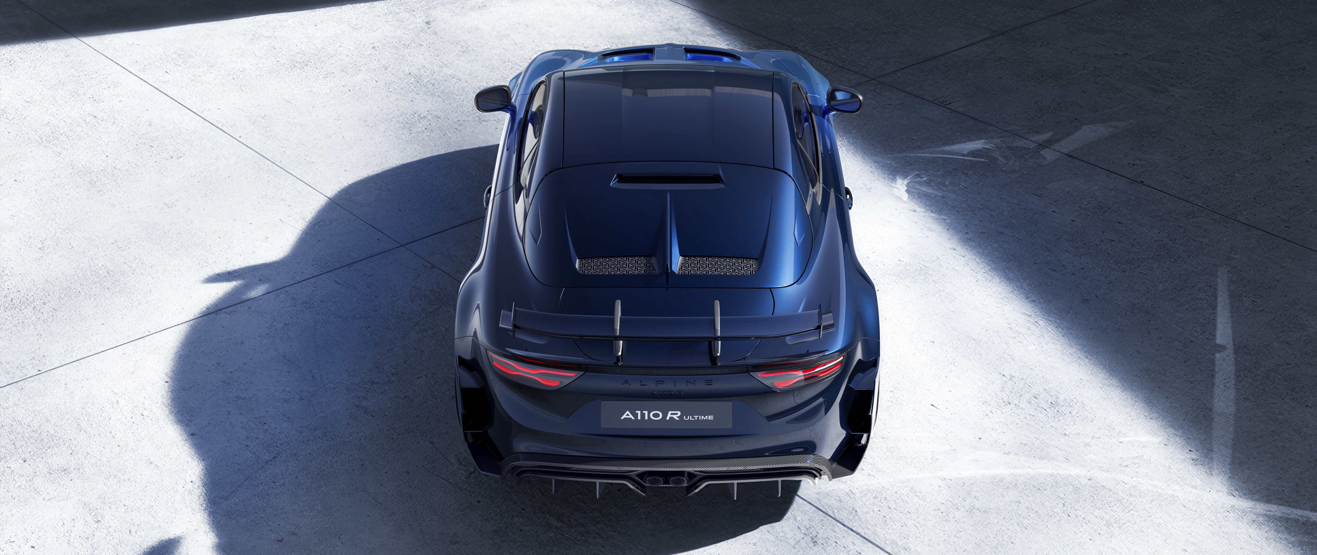 A detailed view of the Alpine A110 R Ultime sports car, highlighting its sleek aerodynamic body and sporty aesthetic.