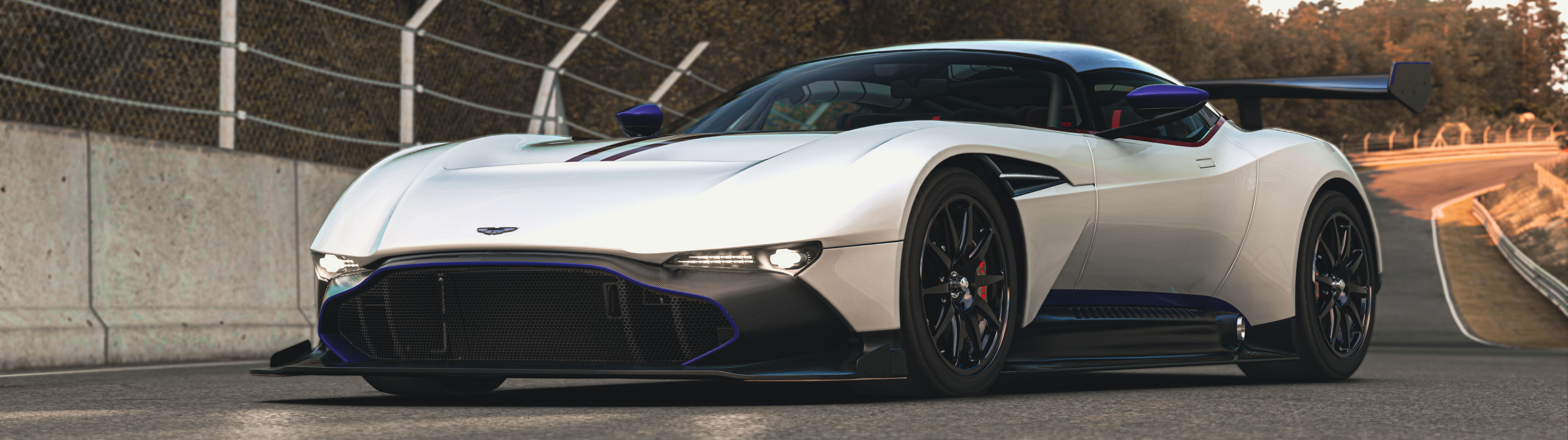 A close-up, dramatic view of the powerful Aston Martin Vulcan supercar.