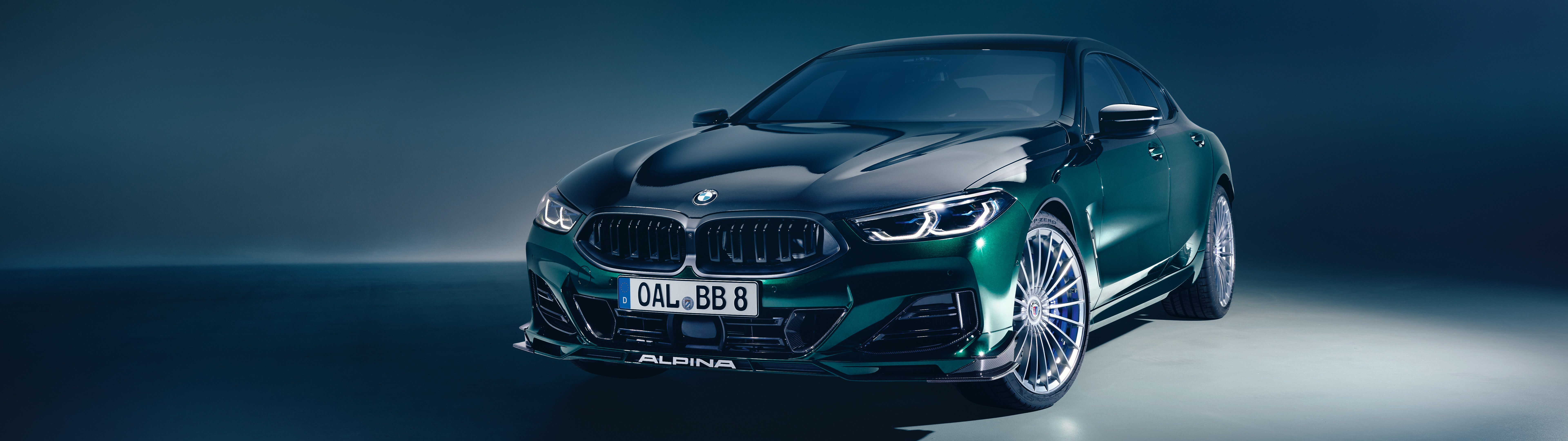 A sleek and powerful BMW Alpina B8 luxury sports car showcased in a professional automotive setting.