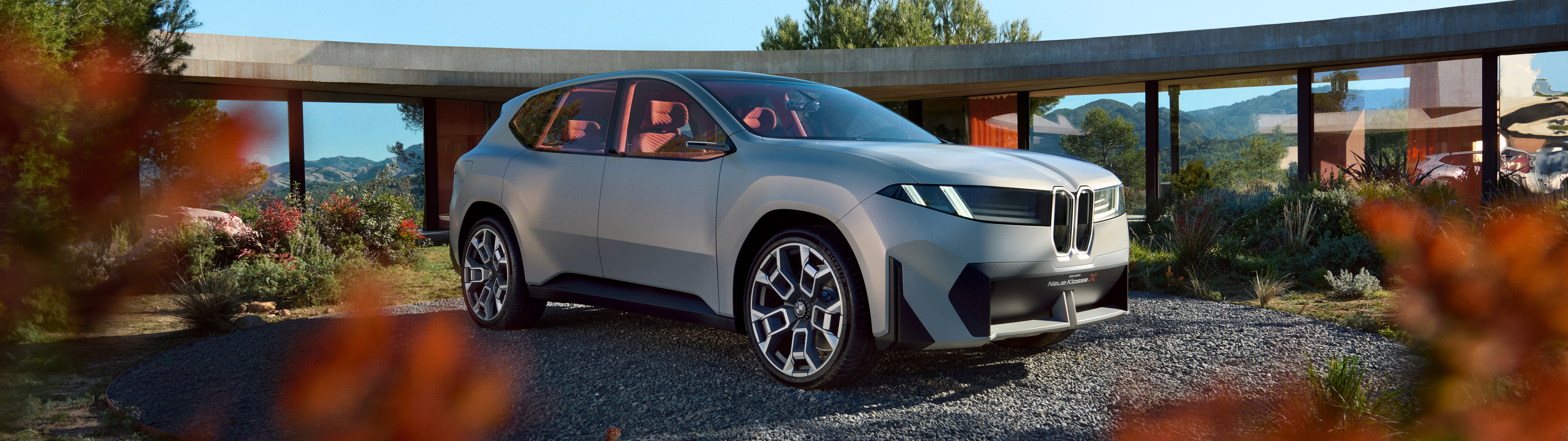 A futuristic BMW Vision Neue Klasse X electric concept car with a modern, aerodynamic design.