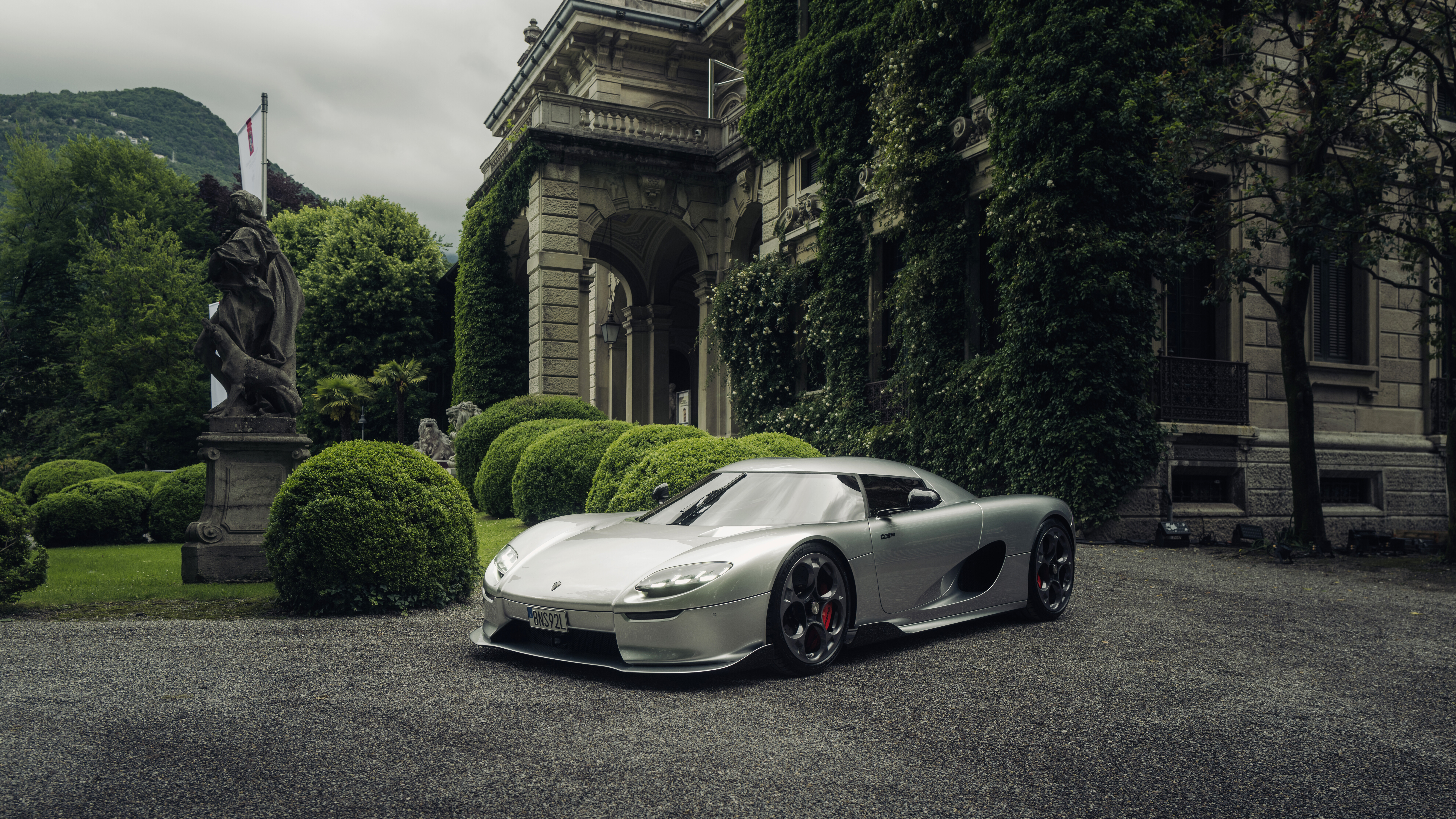 A detailed and sleek view of the Koenigsegg CC850 hypercar highlighting its aerodynamic body and premium finish.