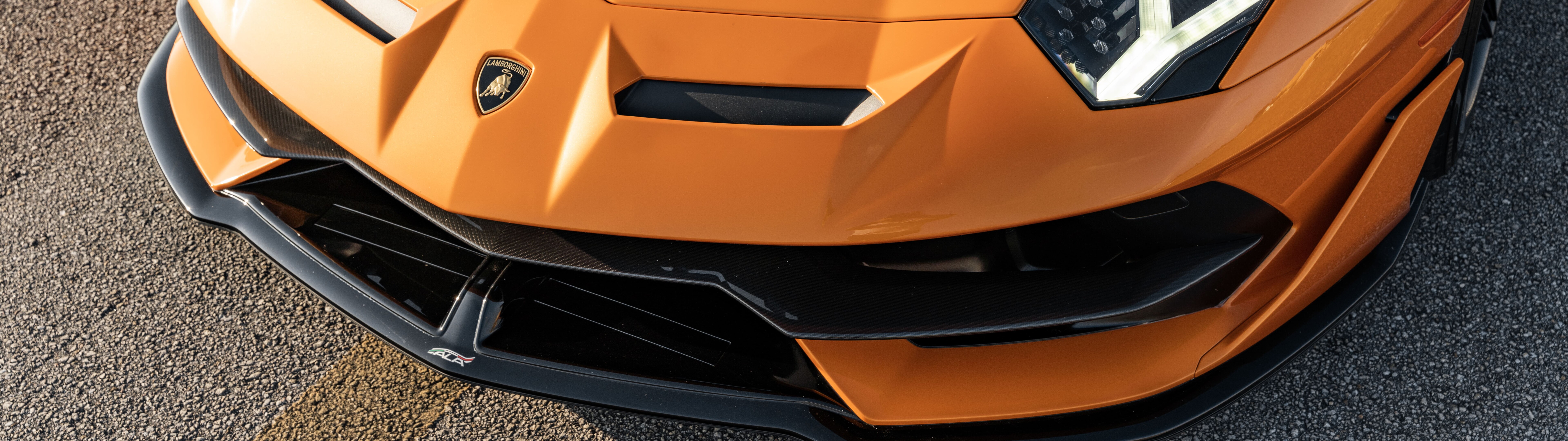 A sleek and powerful Lamborghini Aventador SVJ supercar featuring aggressive aerodynamic styling.
