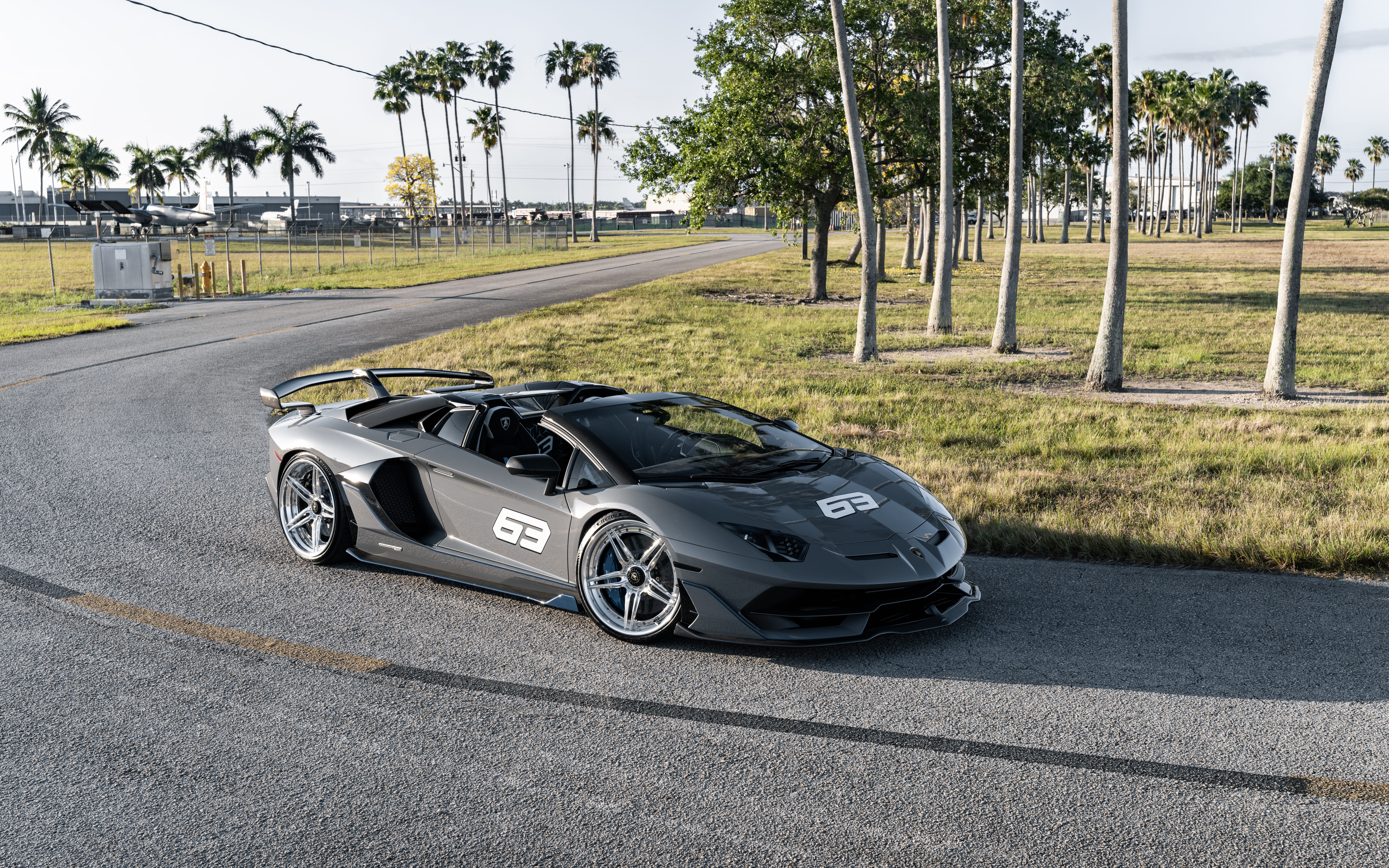 A sleek and powerful Lamborghini Huracan supercar showcasing its aerodynamic design and aggressive front fascia.