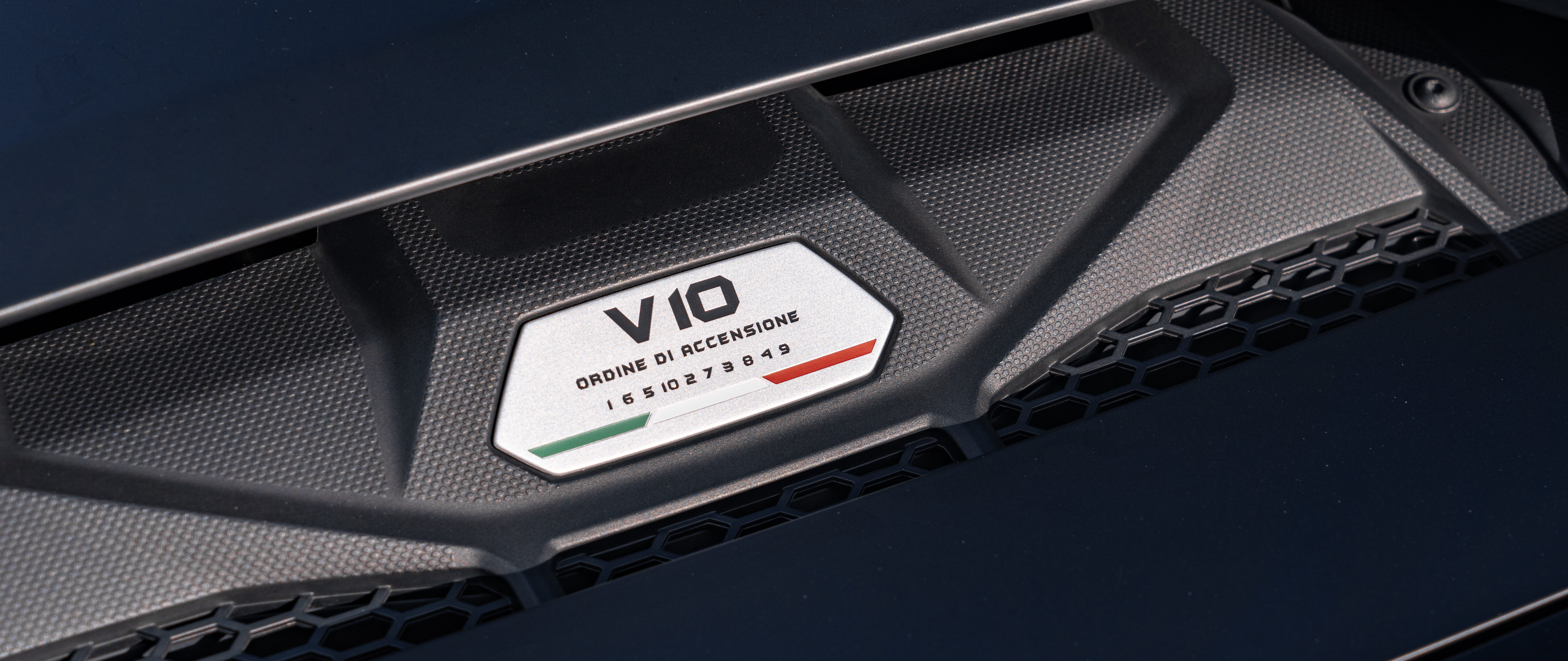 A sleek Lamborghini Huracán supercar captured in high detail, showcasing its aerodynamic design and aggressive styling.