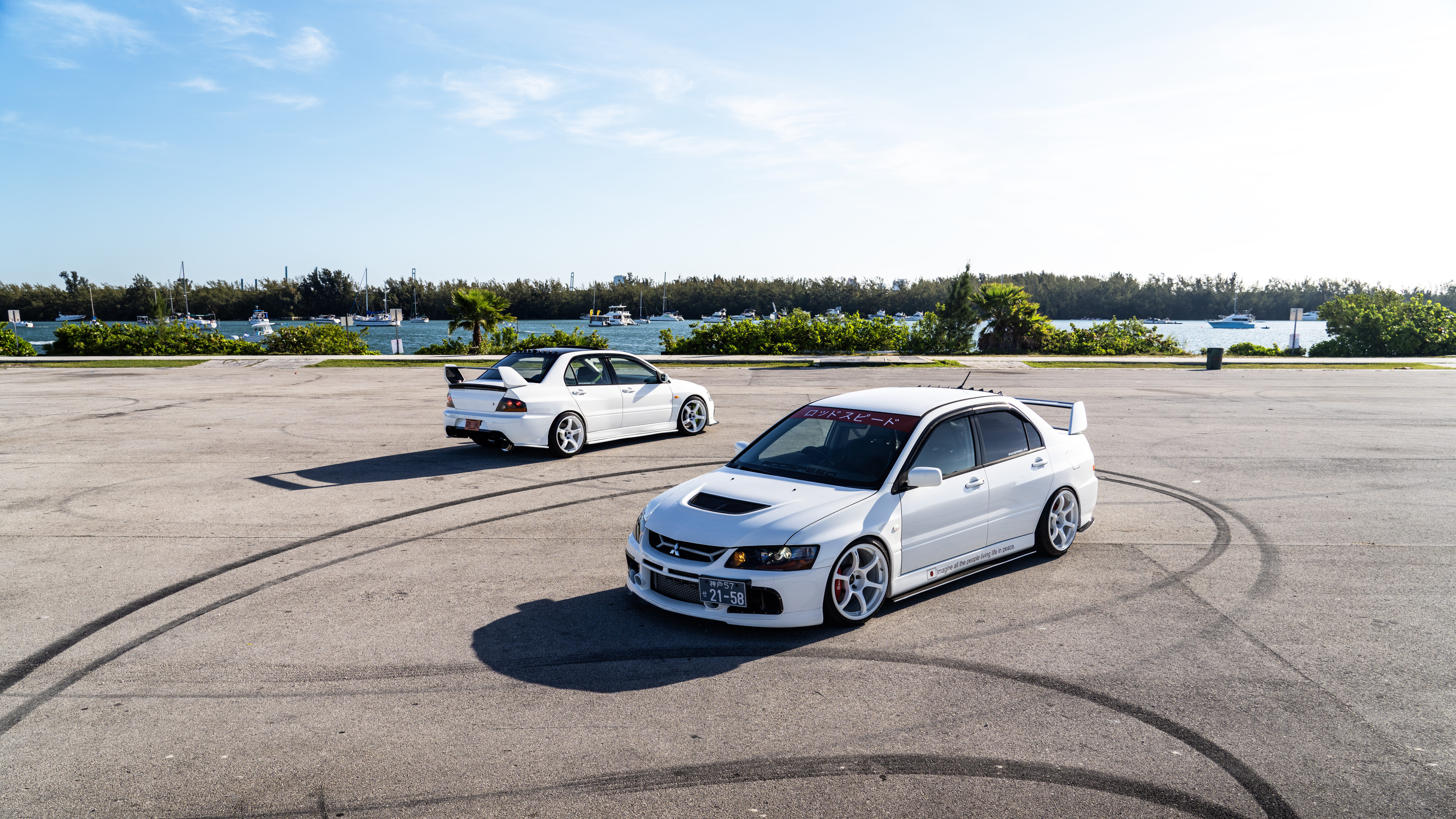 A detailed view of a Mitsubishi Lancer Evolution IX sports sedan showcasing its aerodynamic design.