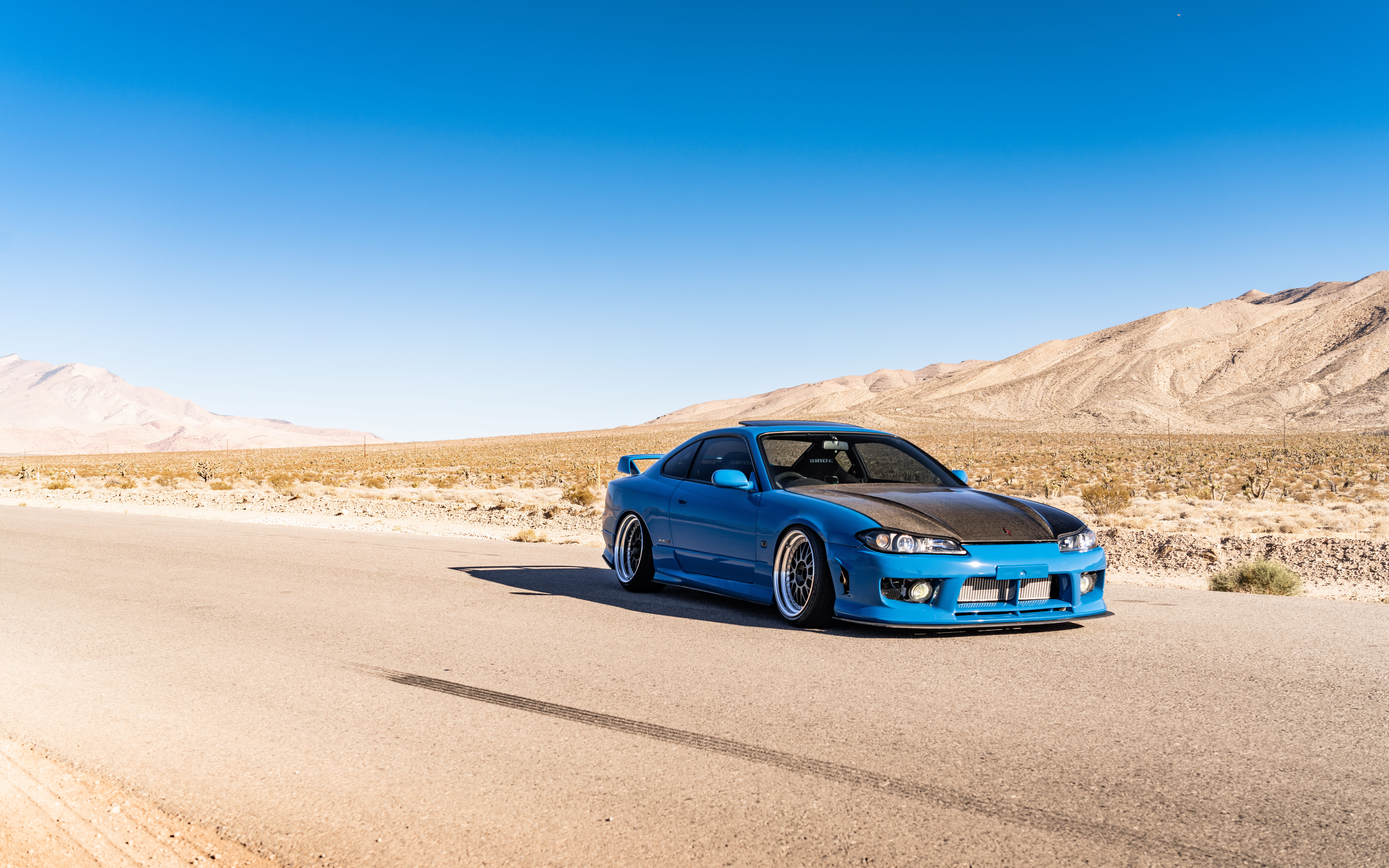 A high-performance Nissan Silvia S15 sports car showcased in a dramatic setting.