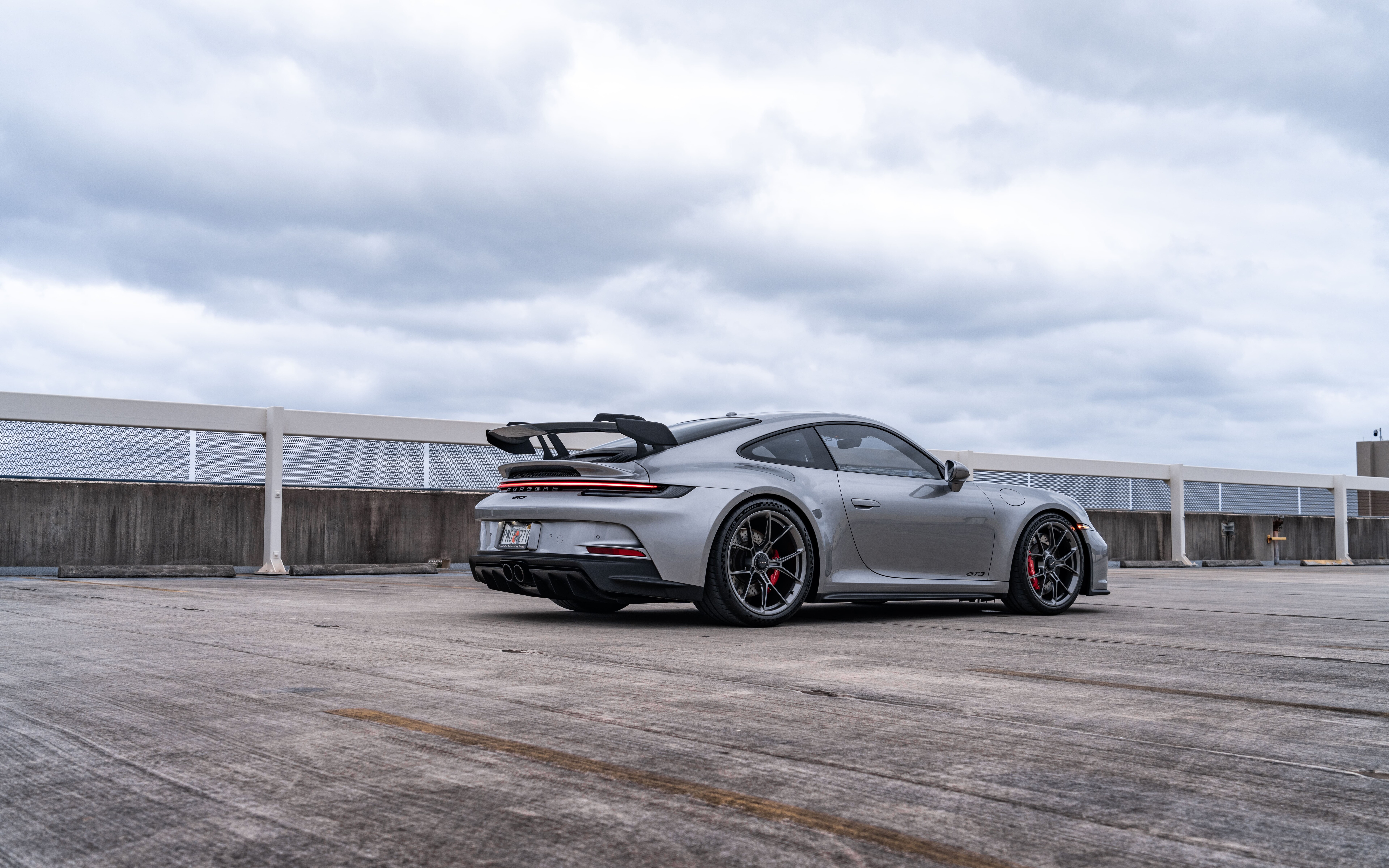 A high-performance Porsche GT3 RS sports car featuring aerodynamic styling and a powerful stance.