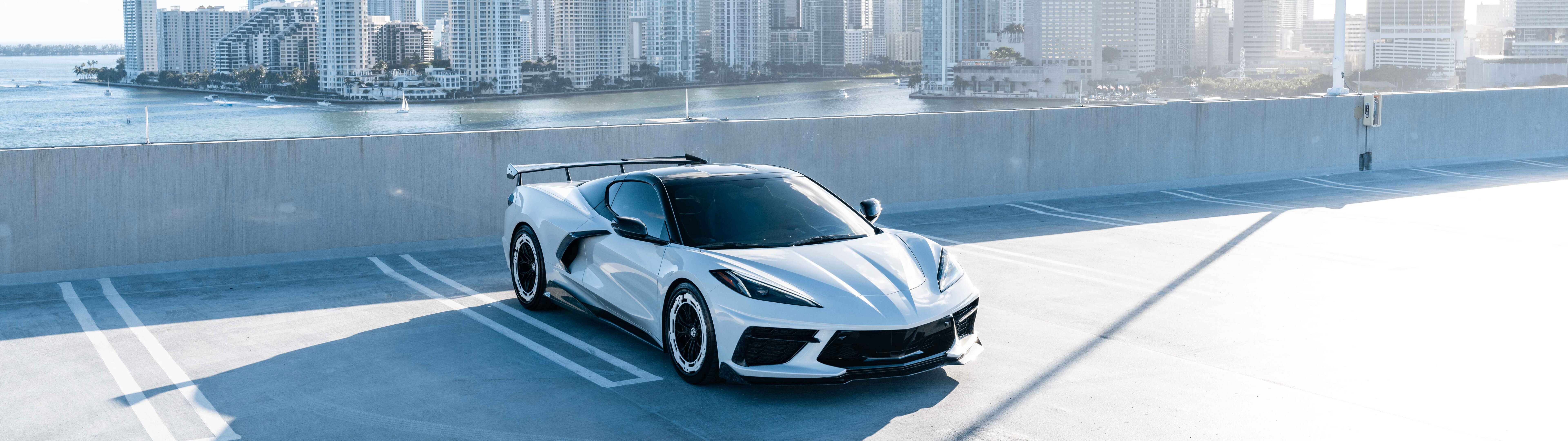 A high-performance Chevrolet Corvette C8 sports car featuring a modern aerodynamic design.