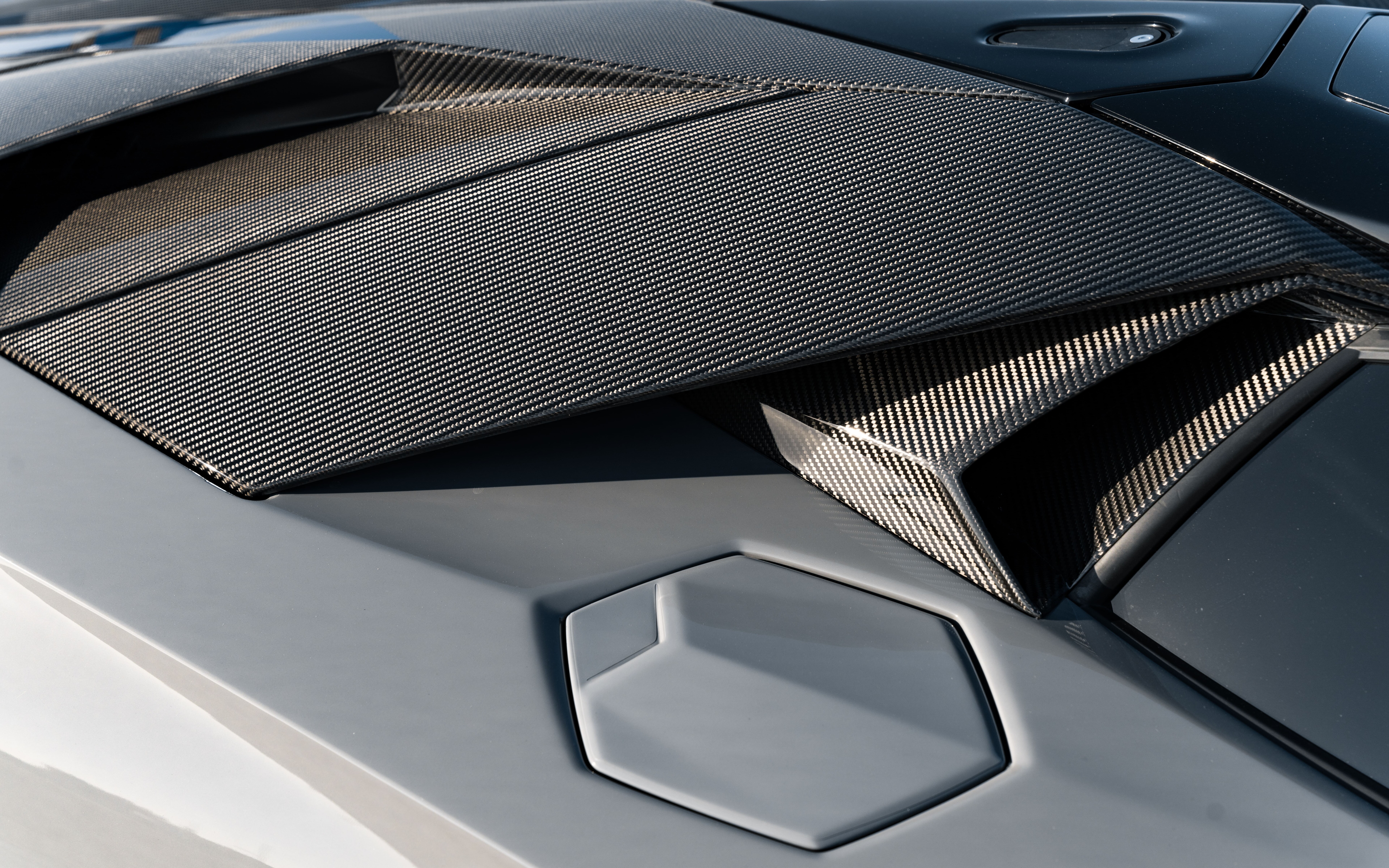 A high-performance Lamborghini Huracán sports car featuring sleek aerodynamic lines and a powerful stance.