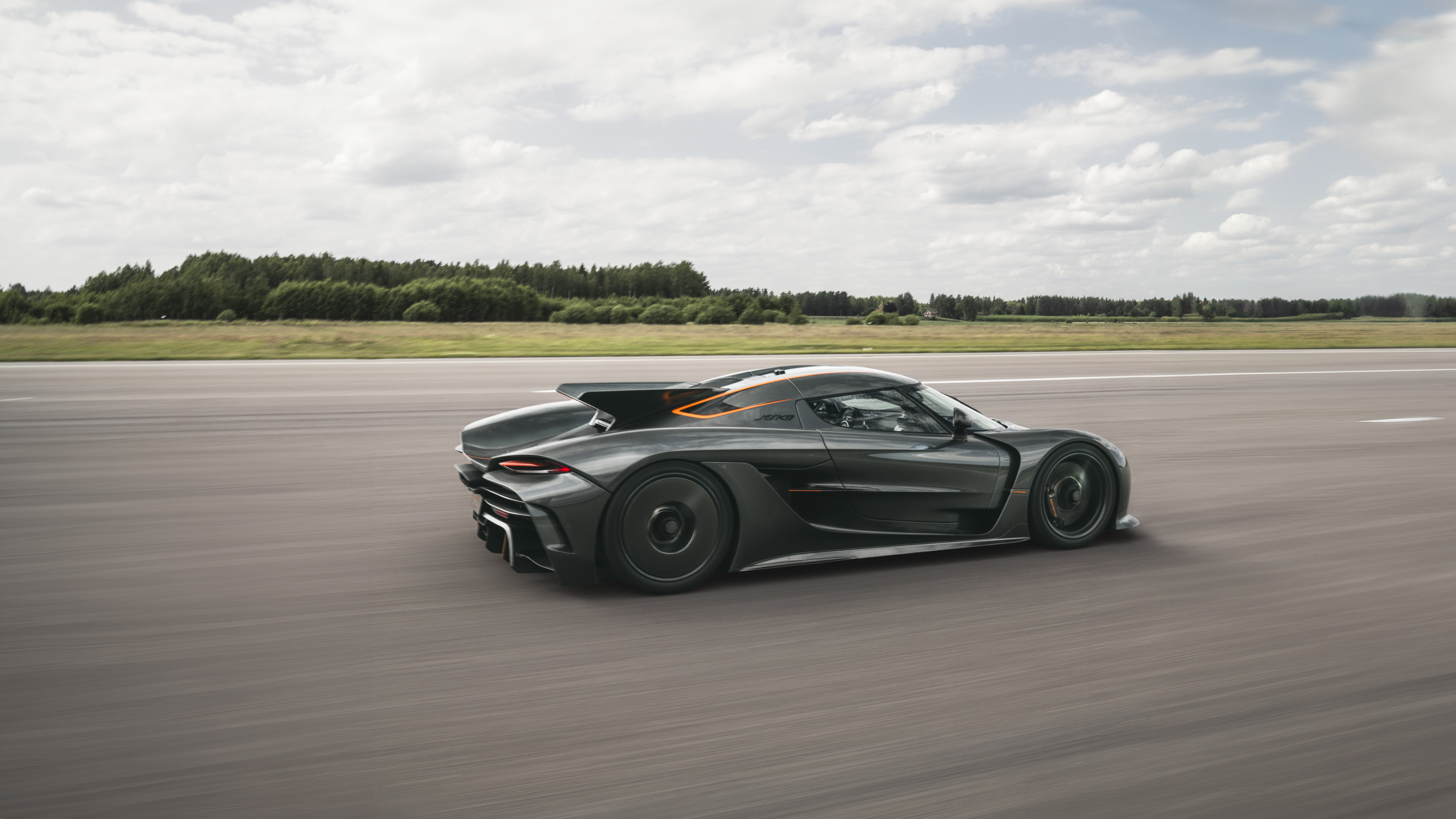 A high-performance Koenigsegg Jesko Absolut hypercar with sleek aerodynamic bodywork.