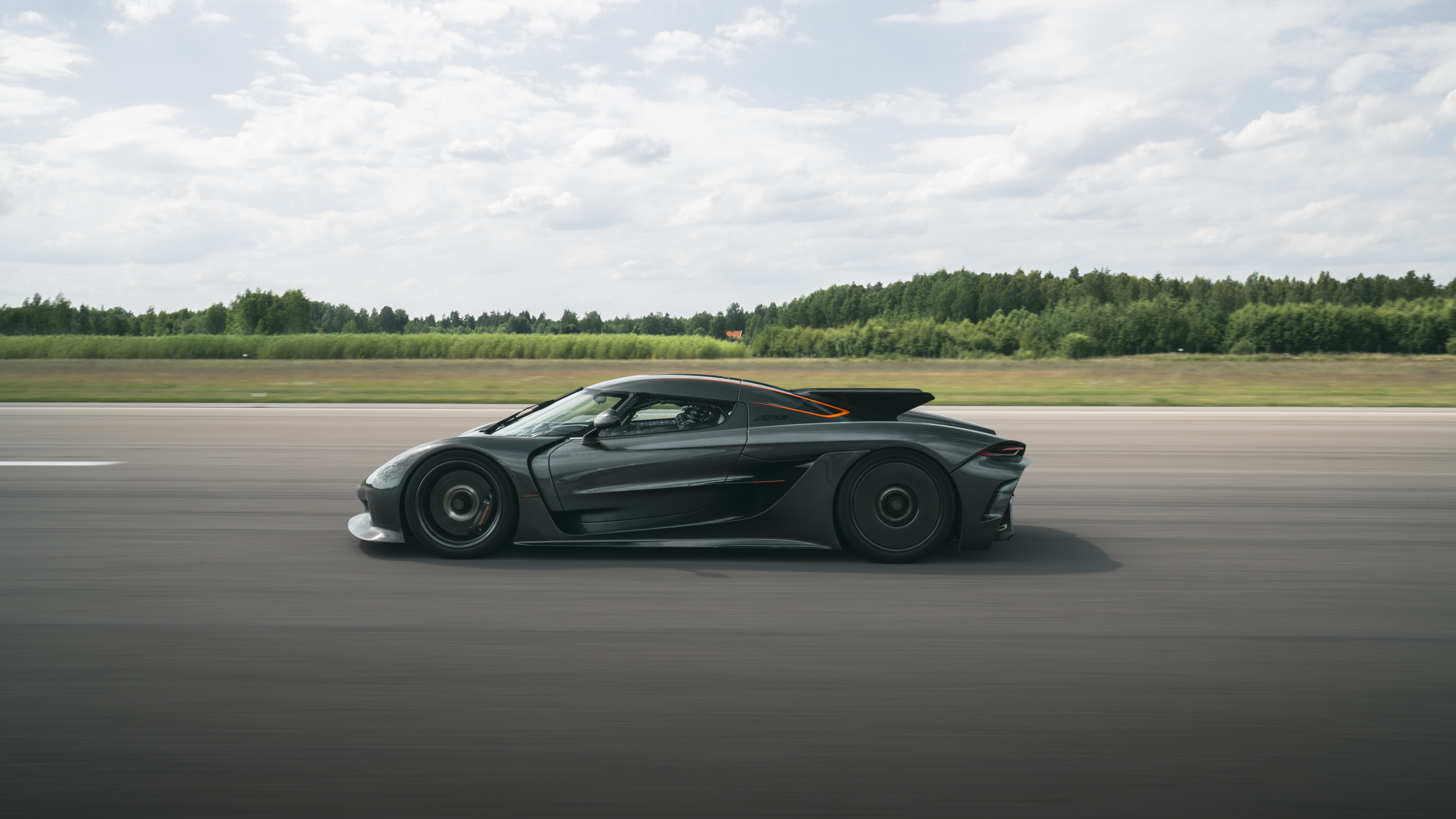 A sleek and aerodynamic Koenigsegg Jesko Absolut hypercar presented in a high-detail view.