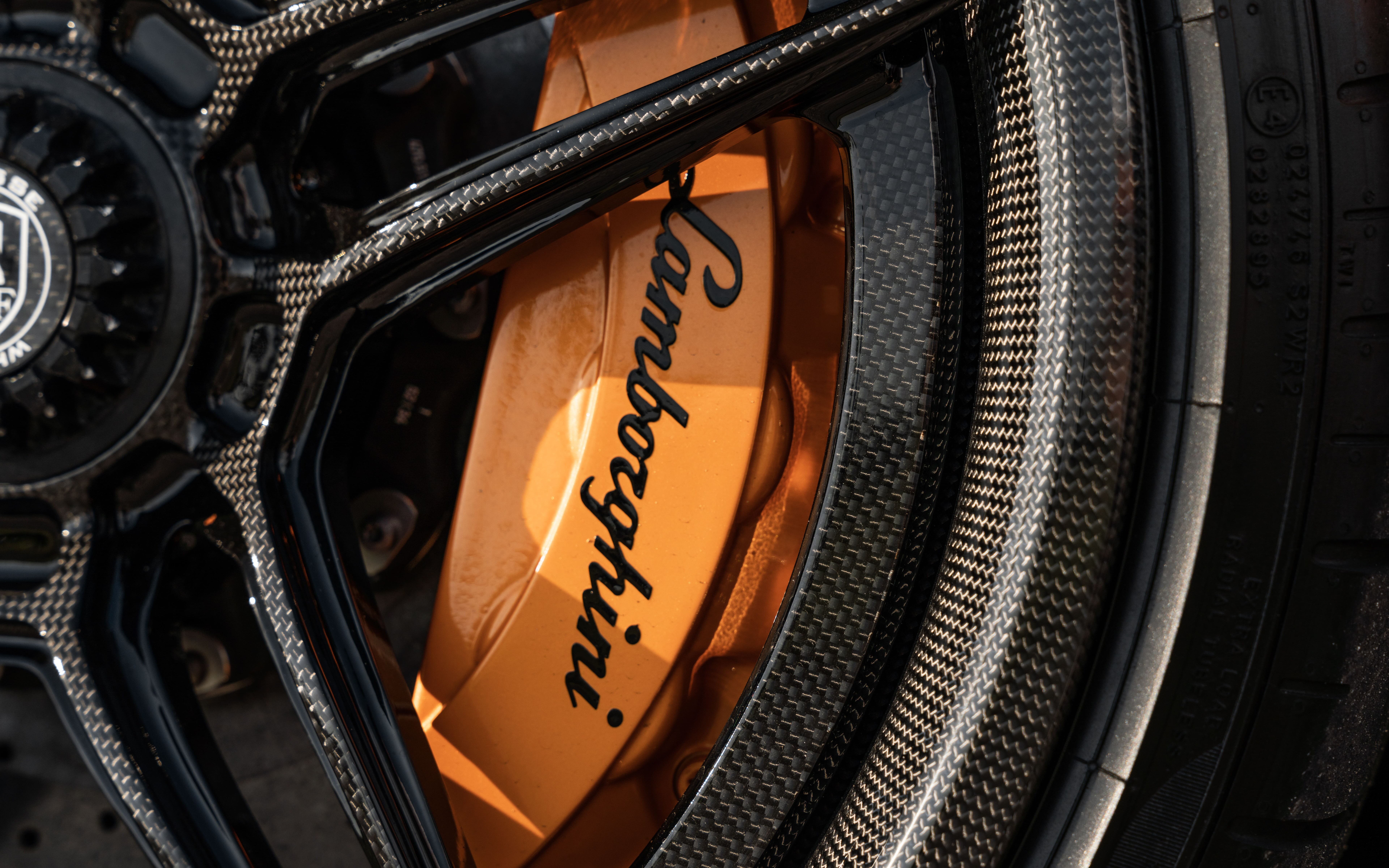 A high-detail shot of a Lamborghini Aventador SVJ supercar featuring its iconic aerodynamic bodywork.
