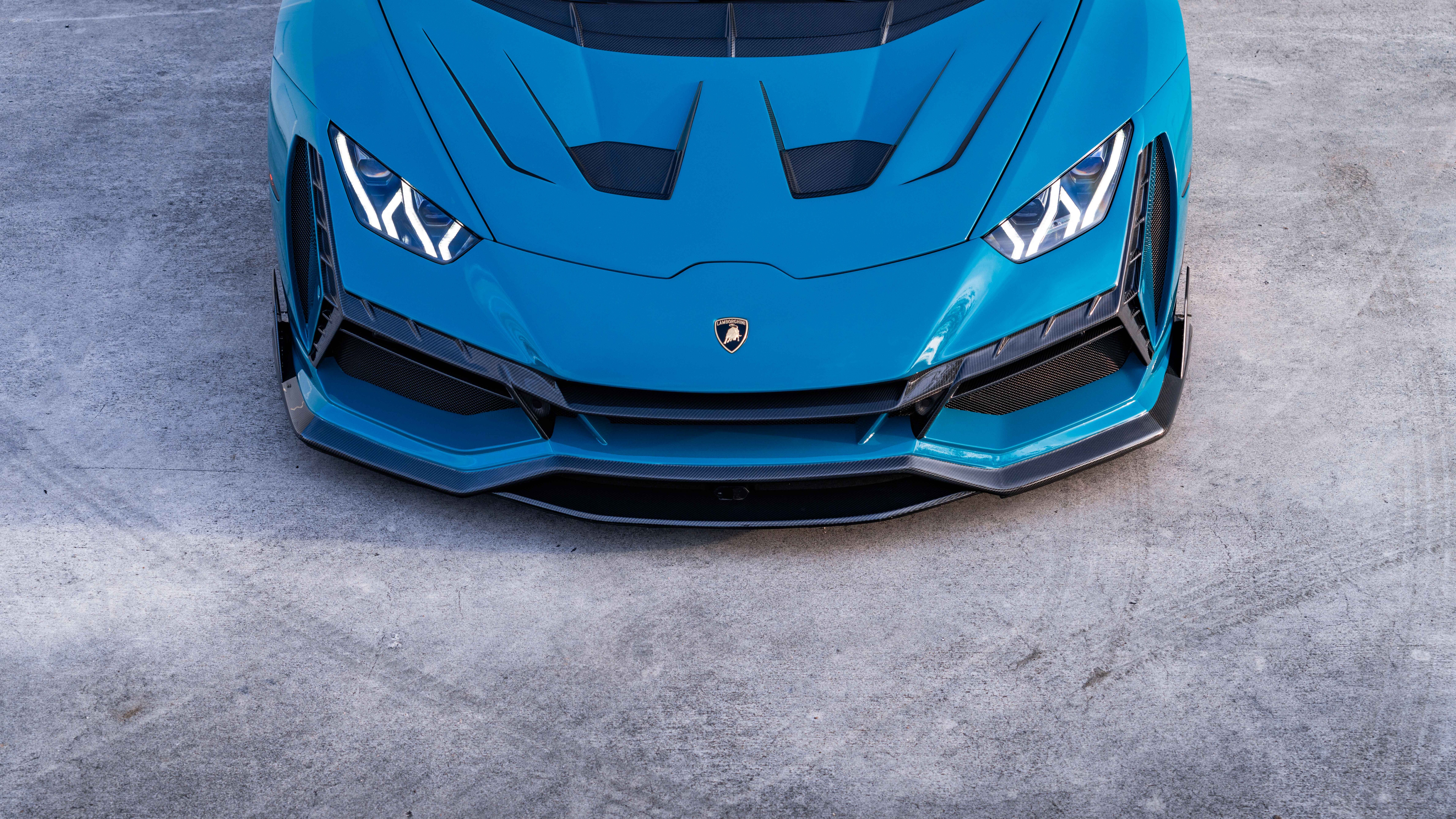 A high-performance Lamborghini Huracan Evo supercar showcasing its aerodynamic design and aggressive contours.