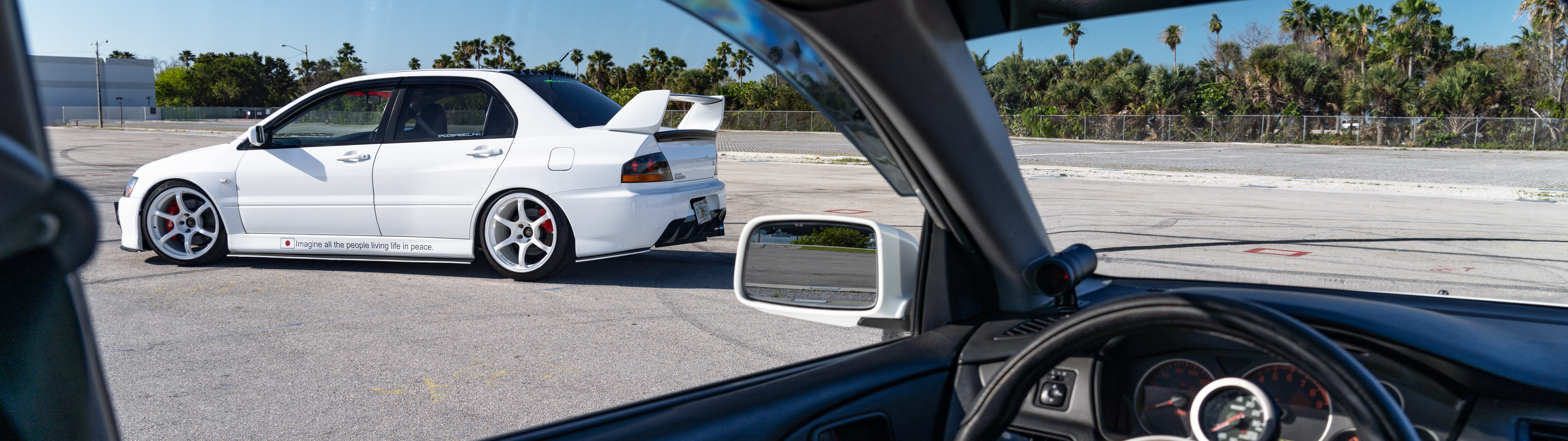 A detailed view of a Mitsubishi Lancer Evolution IX sports car.