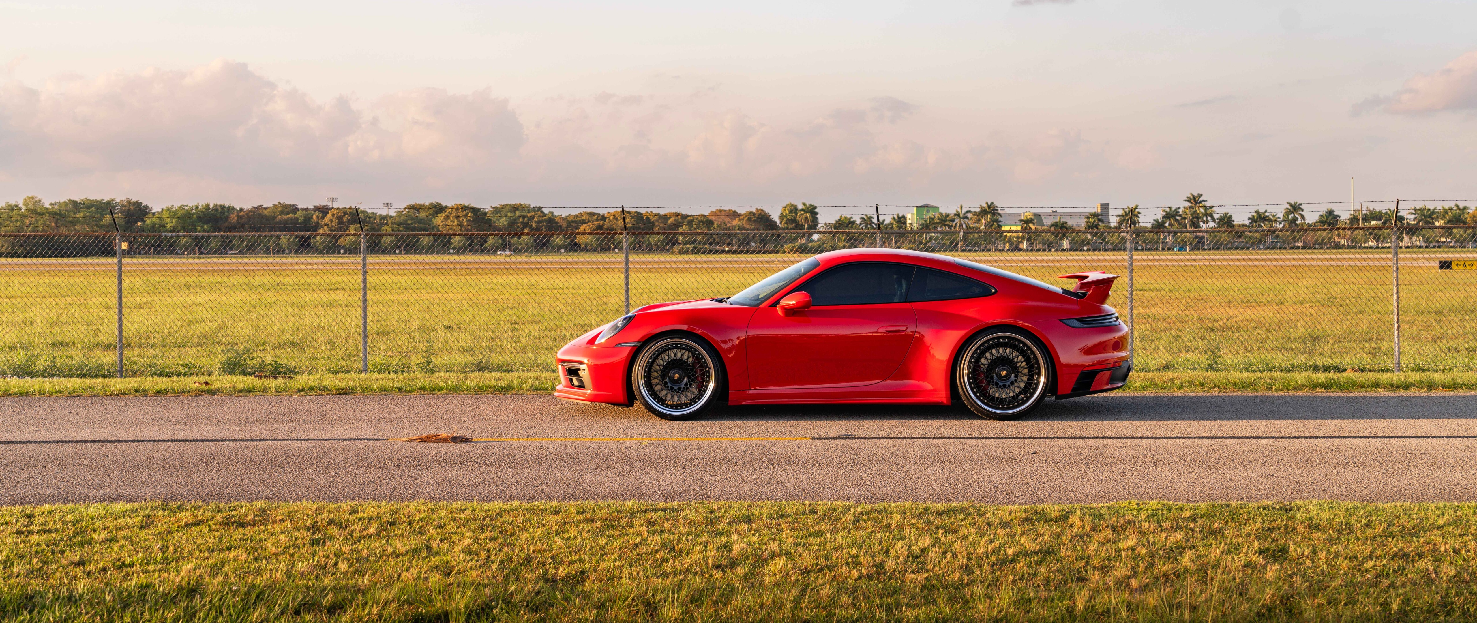 A detailed view of a sleek and powerful Porsche 992 GTS sports car showcasing its modern aerodynamic design.