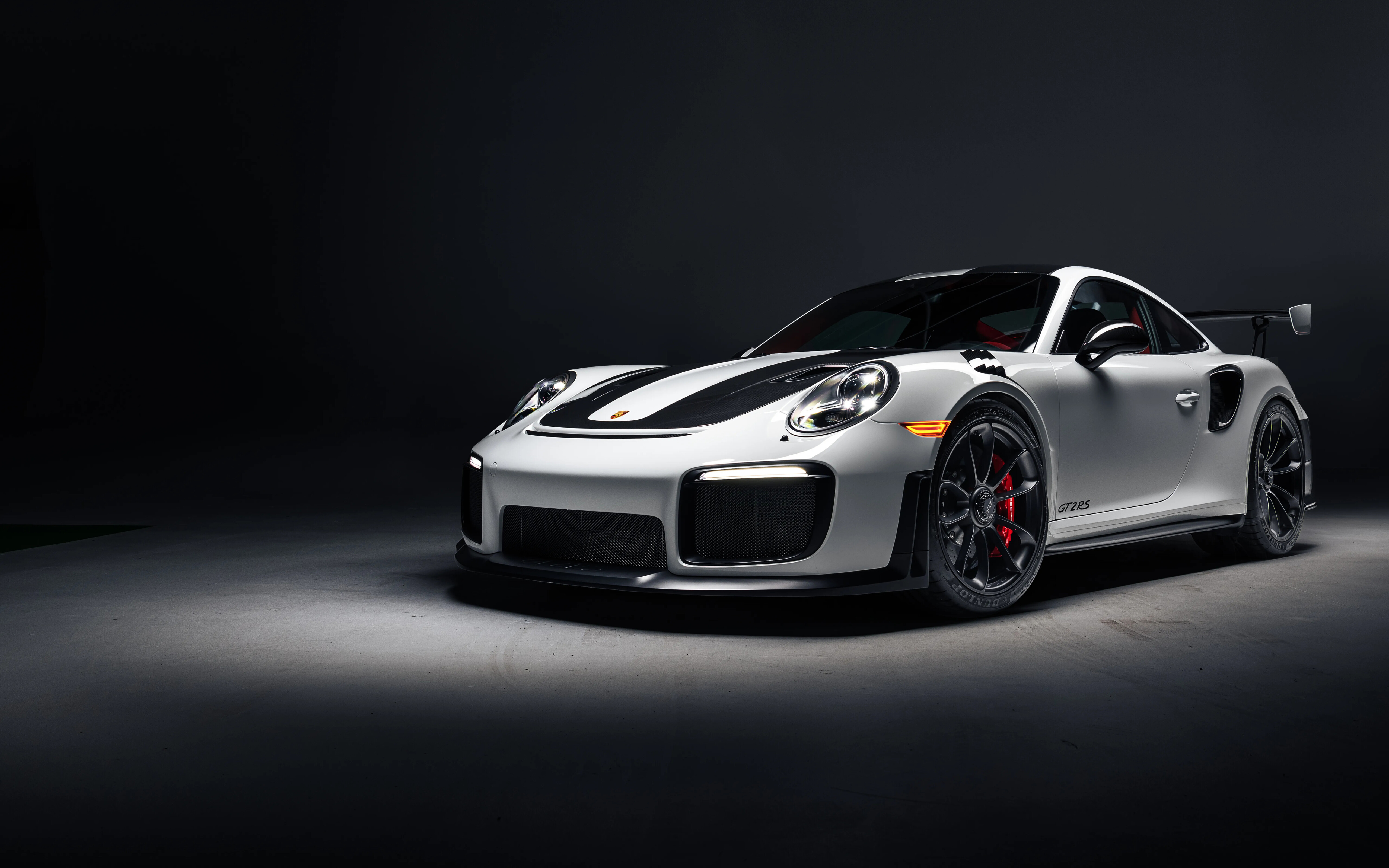 A high-performance Porsche 911 GT2 RS Weissach sports car featuring aggressive aerodynamic styling.