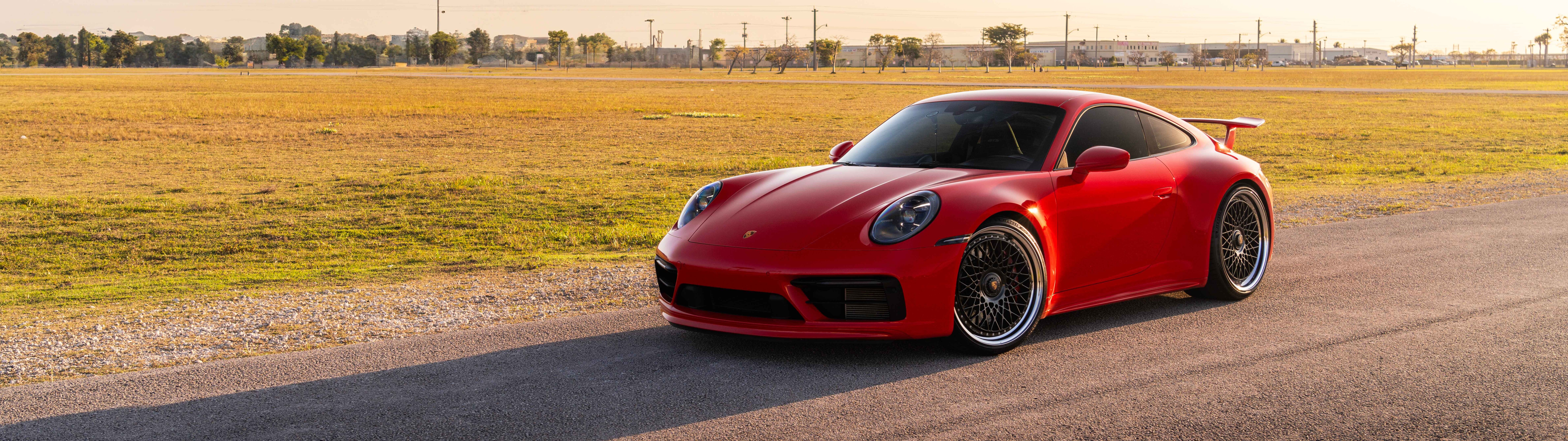 A sleek Porsche 992 GTS sports car featuring a polished exterior and iconic design.